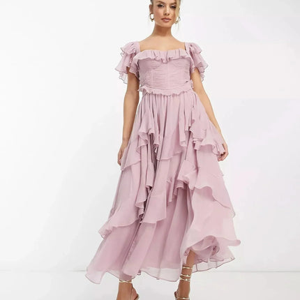 Blush pink ruffle midi dress with off-shoulder sleeves and flowing layered skirt, wedding guest dress