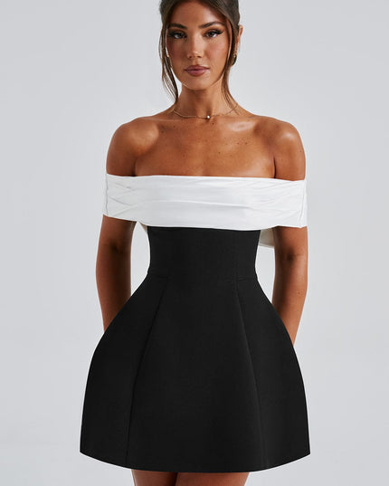 Front view of off shoulder mini dress with white draped neckline and structured black skirt