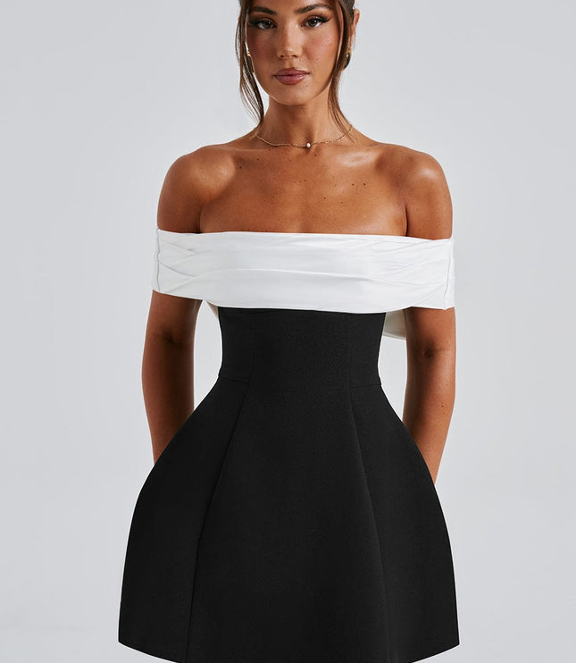 Front view of off shoulder mini dress with white draped neckline and structured black skirt