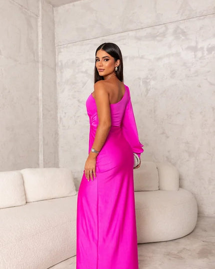 Back view of magenta satin maxi dress with one shoulder and fitted silhouette