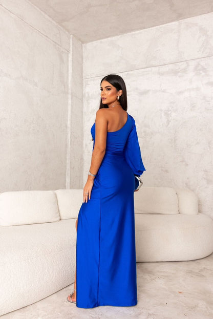 Back view of royal blue satin maxi dress with one shoulder and long drape