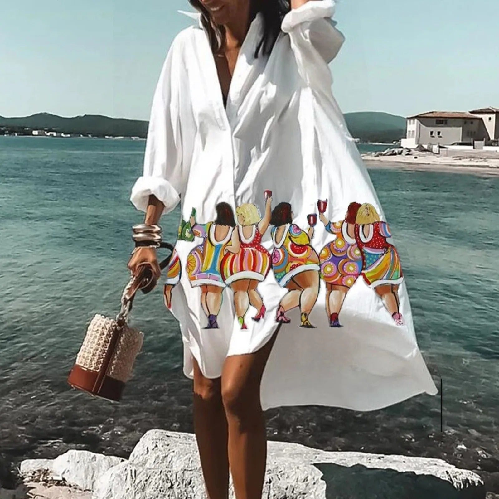 White beach mini shirt dress with colorful cartoon figure print and loose long-sleeve silhouette