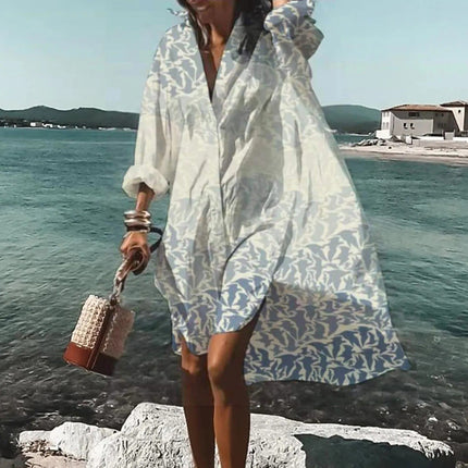 White beach mini shirt dress with pale leaf print, long sleeves, and relaxed loose fit