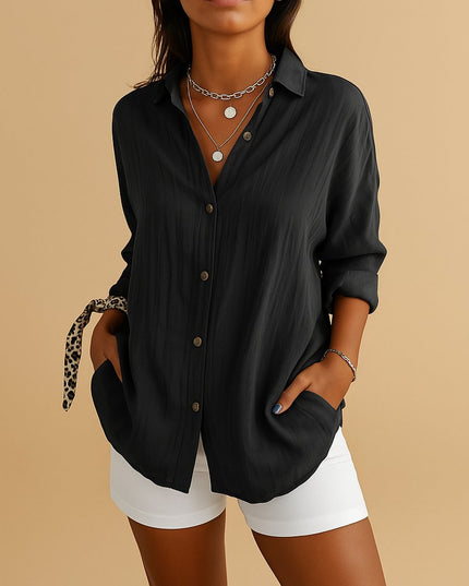 Black linen button down long sleeve shirt with loose fit and rolled sleeves