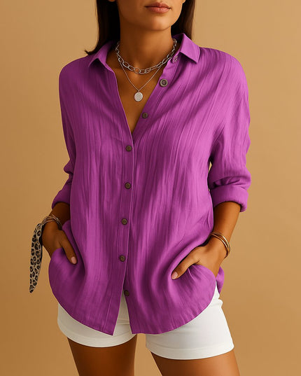 Purple linen button down shirt with rolled sleeves and relaxed summer style