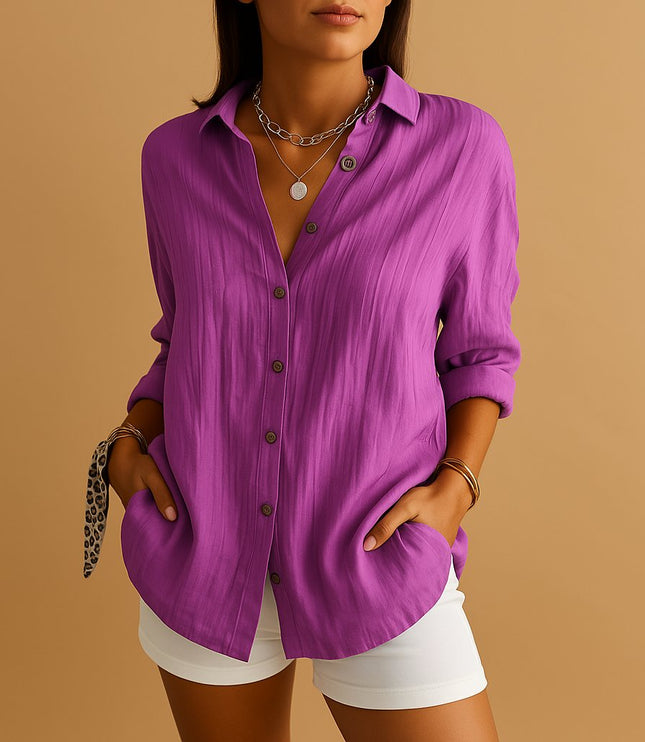 Purple linen button down shirt with rolled sleeves and relaxed summer style