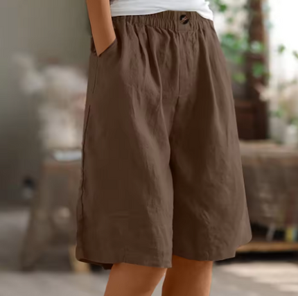 Brown relaxed Bermuda shorts for women with elastic waistband, roomy fit, and side pockets