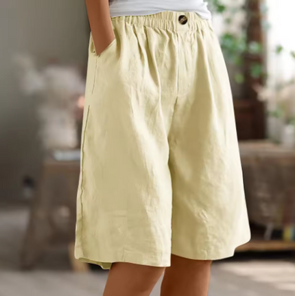 Light beige women Bermuda shorts with elastic waist, loose leg opening, front button and pockets