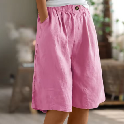 Pink women relaxed Bermuda shorts with elastic waist, soft drape fabric, button accent and pockets