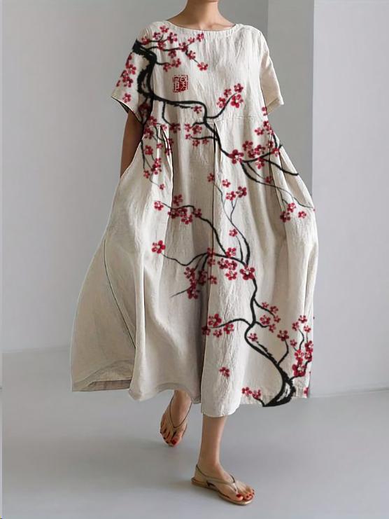 White floral midi dress with black branch print and red blossoms, loose summer dress