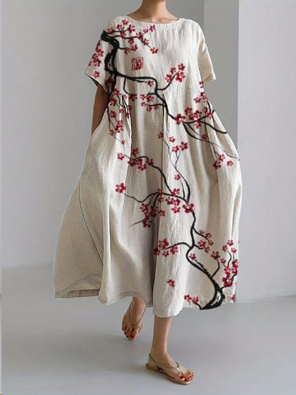 White floral midi dress with black branch print and red blossoms, loose summer dress