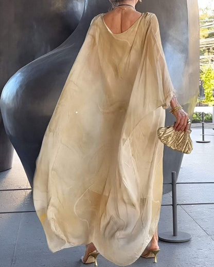 Back view of beige abstract print maxi dress with flowing sheer sleeves