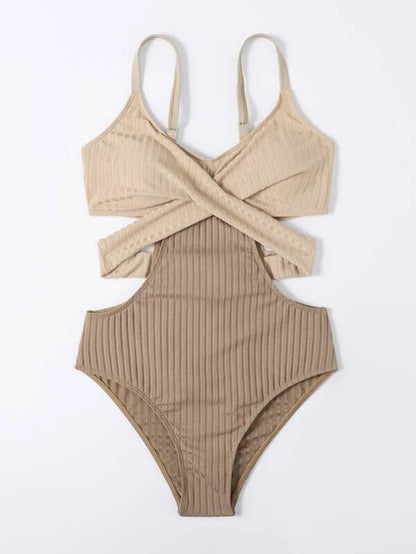 Front view of beige ribbed one piece swimsuit with thin straps and wrap style cut out design