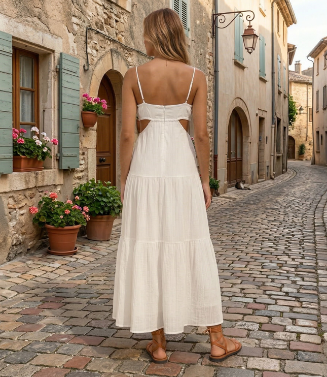 Back view of white summer maxi dress with thin straps and cutout waist detail