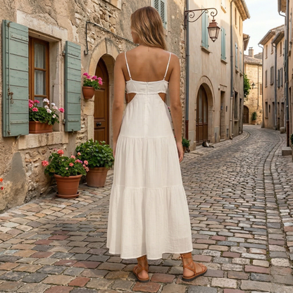 Back view of white summer maxi dress with thin straps and cutout waist detail