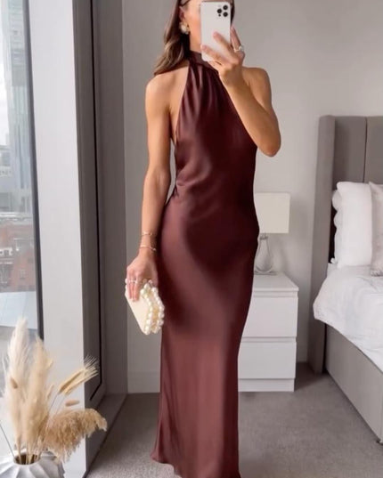 Mirror selfie view of burgundy satin halter midi dress with sleeveless cut and midi length
