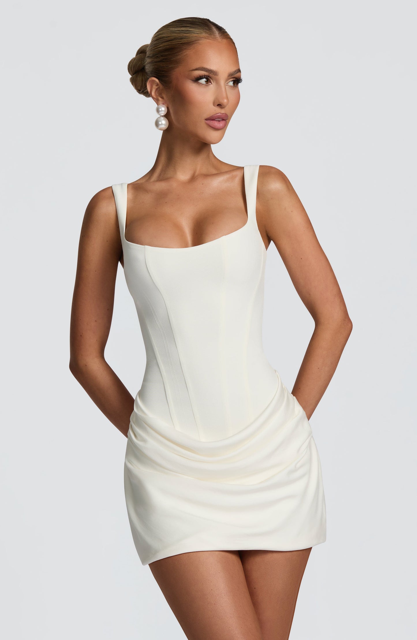 Ivory satin mini dress with square neckline and draped skirt, front view