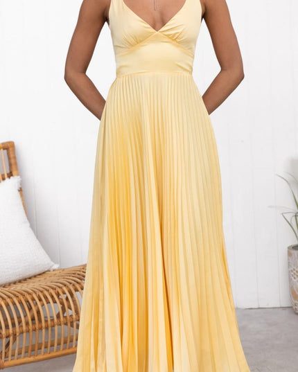 Front view of yellow sleeveless maxi dress with V neck and pleated skirt