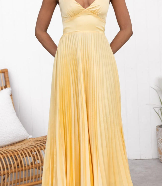 Front view of yellow sleeveless maxi dress with V neck and pleated skirt