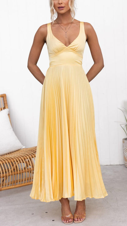 Front view of yellow sleeveless maxi dress with V neck and pleated skirt