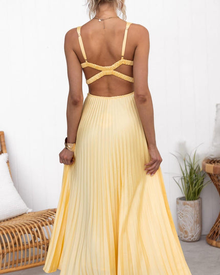 Rear view of pleated V neck maxi dress showing open back and flowing skirt