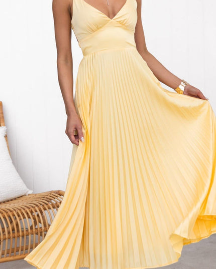 Women's yellow pleated V neck maxi dress with sleeveless bodice and flowing skirt