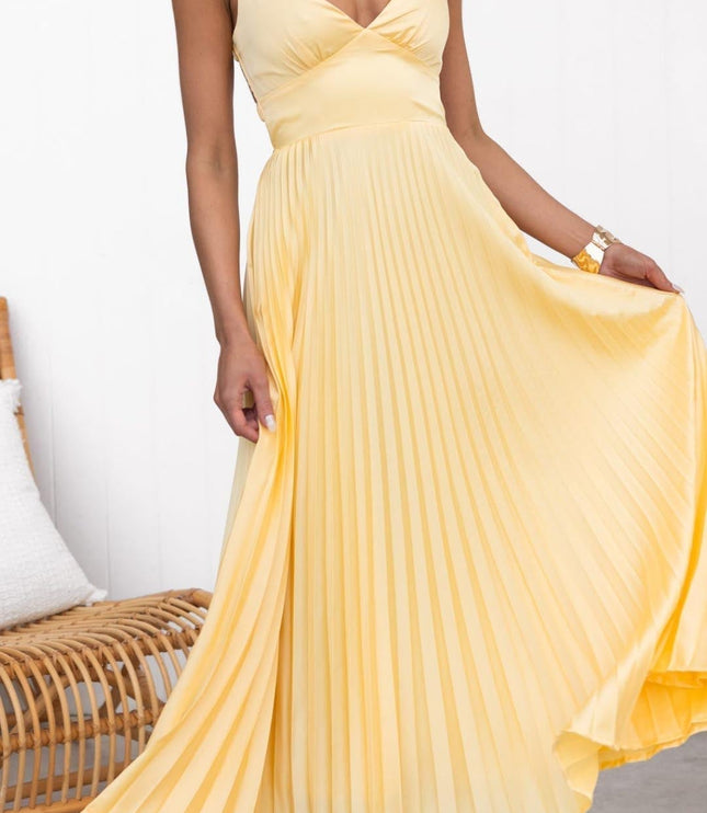 Women's yellow pleated V neck maxi dress with sleeveless bodice and flowing skirt