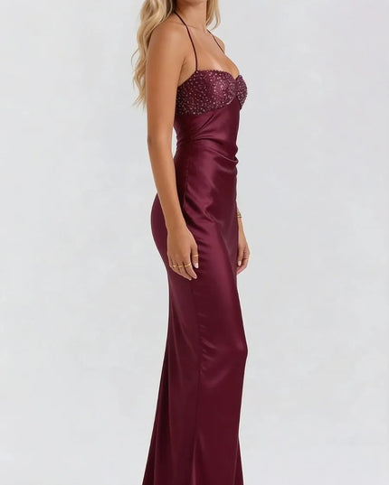 Side view of burgundy satin maxi dress with beaded sweetheart neckline