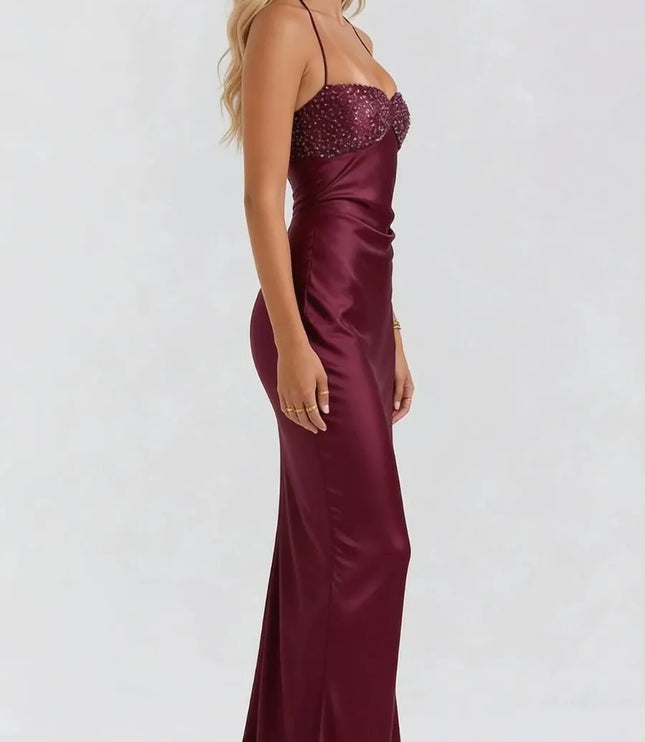 Side view of burgundy satin maxi dress with beaded sweetheart neckline