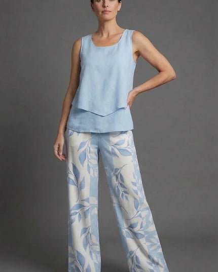 Front view of light blue sleeveless top and matching wide leg floral pants co ord set