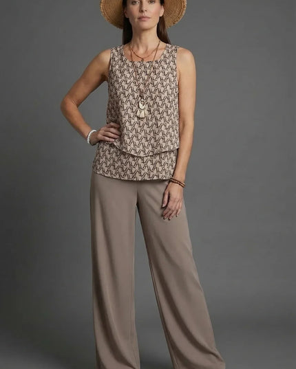 Beige sleeveless patterned top with loose wide leg linen pants and straw hat co ord set