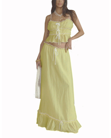 Yellow summer maxi skirt set with ruffled crop top and matching long skirt on white background