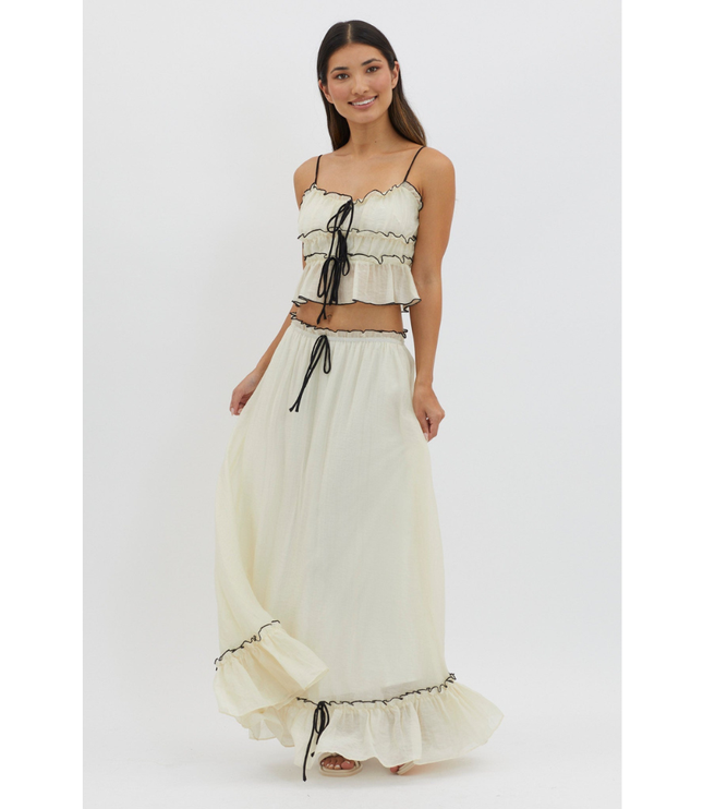 Cream maxi skirt set with black trim and tie-front crop top, front view on white background