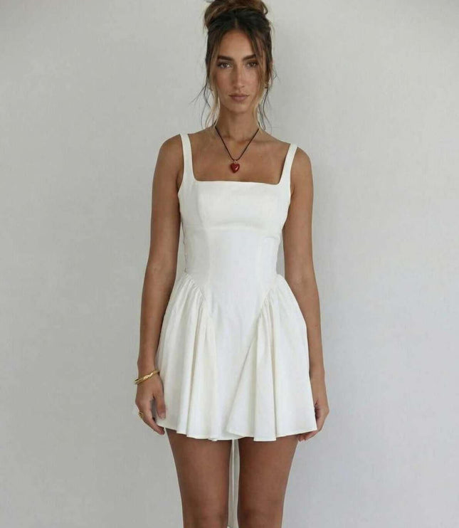Front view of white wedding guest mini dress with square neckline and gathered skirt