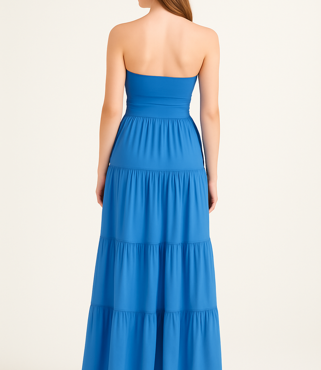 Back view of women's blue strapless maxi dress with smooth bodice and tiered skirt