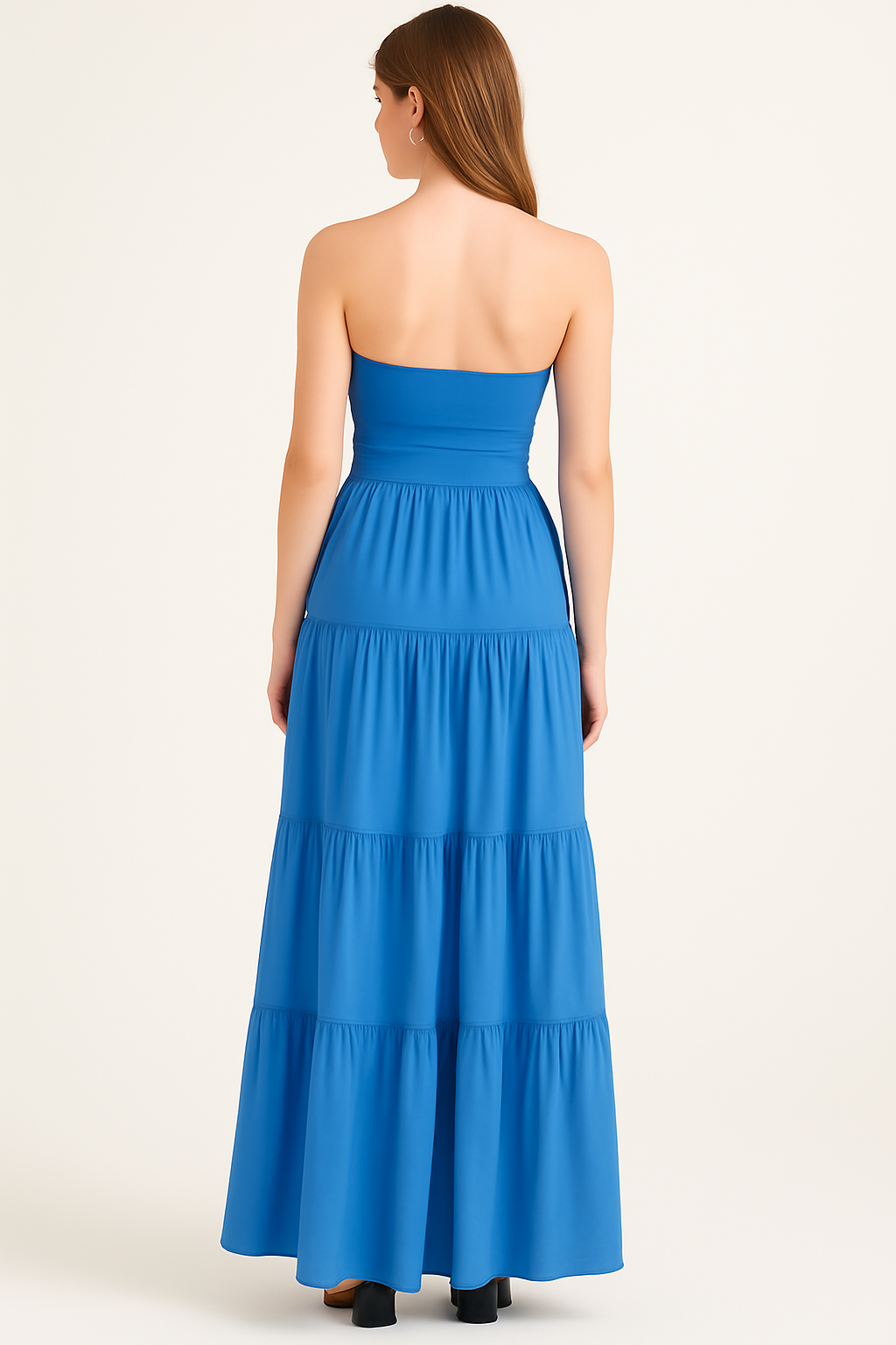 Back view of women's blue strapless maxi dress with smooth bodice and tiered skirt