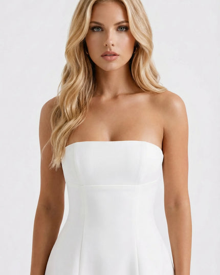 Front view of white strapless mini dress with defined waistline and A-line silhouette