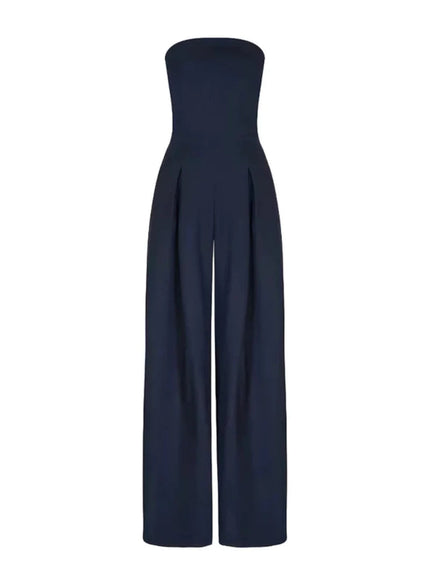 Front view of a navy strapless jumpsuit with pleated wide leg pants and clean neckline