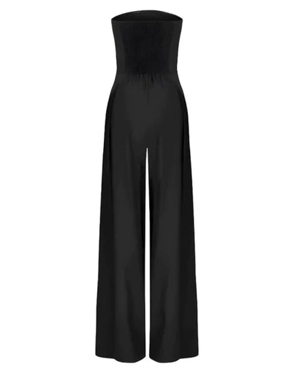 Black strapless wide leg jumpsuit with pocket detail styled on a model against draped backdrop