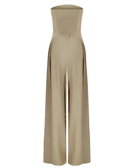 Beige strapless jumpsuit shown flat with smocked back and flowing wide leg pants