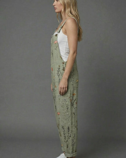 Side view of botanical print romper with relaxed fit, wide legs, and cuffed hems