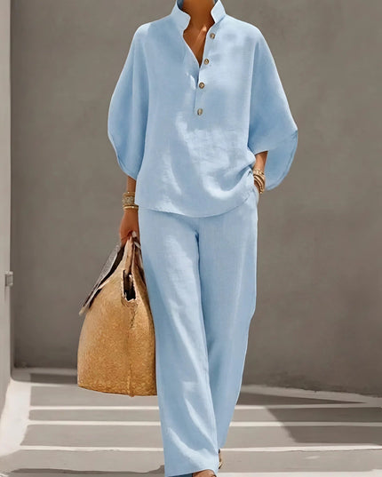 Light blue two piece set featuring half button shirt top and wide leg linen pants
