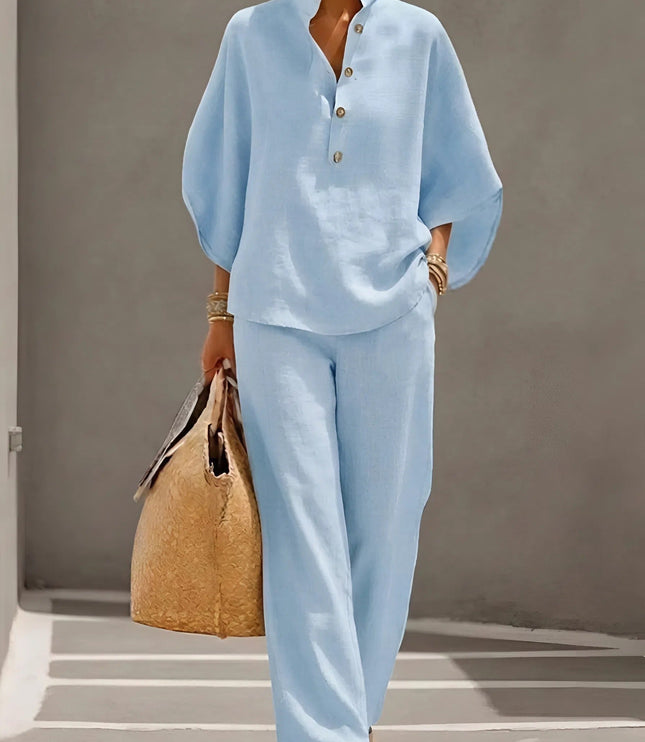 Light blue two piece set featuring half button shirt top and wide leg linen pants