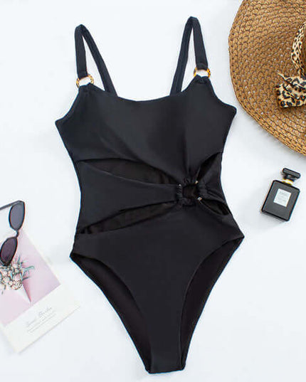 Black one piece swimsuit with side cutouts, ring accent, and adjustable straps