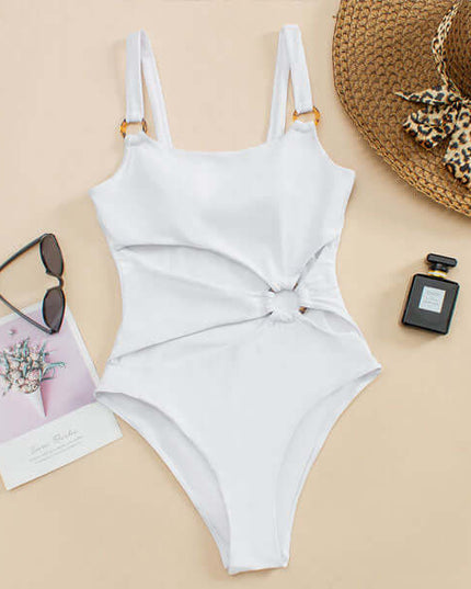 White cut out one piece swimsuit laid flat with square neckline and ring detail