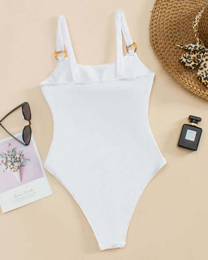 Back view of white one piece swimsuit with scoop back and high cut leg opening