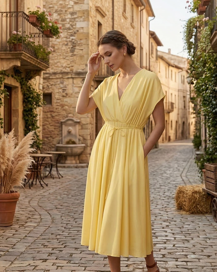 Yellow summer dress with deep V neck, short sleeves, pockets and tie waist