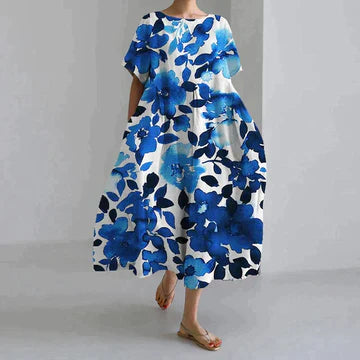 Blue floral printed midi dress with short sleeves and relaxed A-line silhouette
