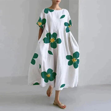 White printed midi dress with large green flower pattern, relaxed fit, breezy summer dress