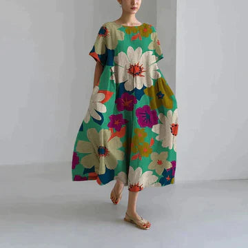 Green midi dress with bold oversized flower print, short sleeves, airy casual summer dress
